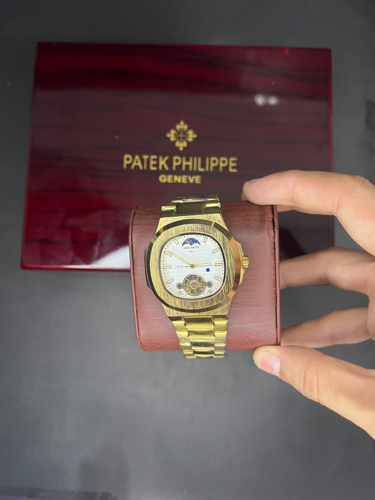 gold tone PATEK PHILIPE NAUTILUS SWATCH WITH MOON PHASE AND TOURBILLON COMPLICATION