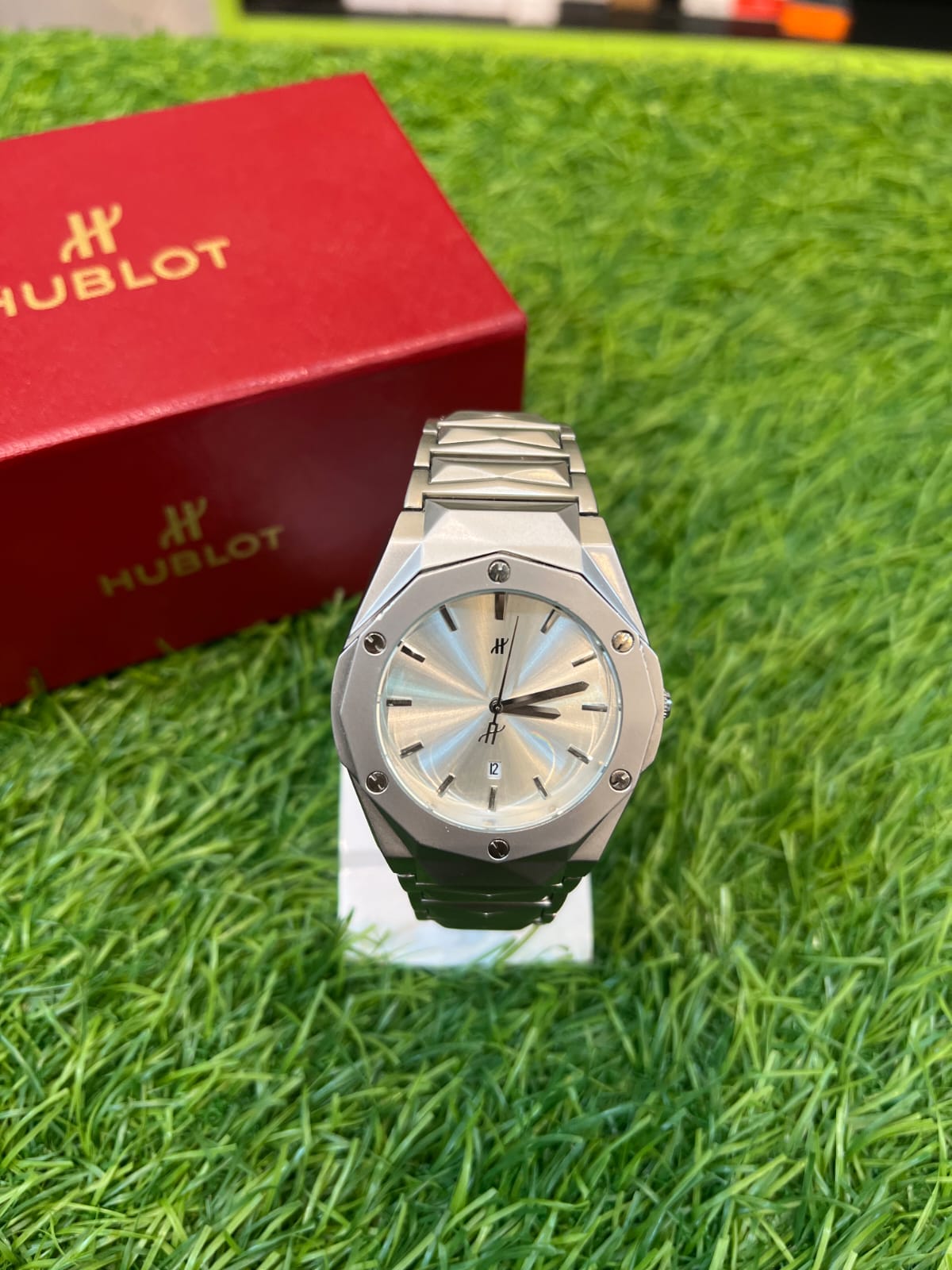 Hublot Classic Fusion watch with a silver dial and a stainless steel bracelet. 