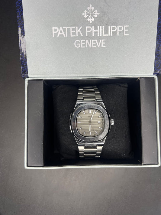 Patek Philippe Nautilus watch in silver stainless steel with a grey dial. 